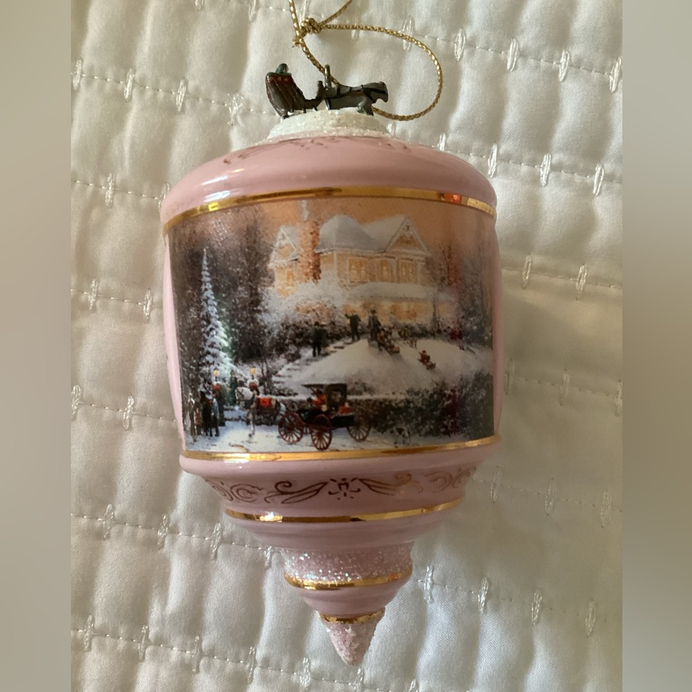 Elegant pink/gold Thomas Kinkade collectible holiday ornament with winter scene
